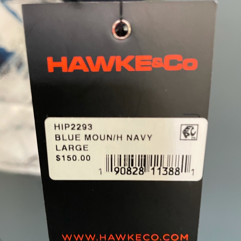 White, blue, and navy water resistant, thermal jacket.